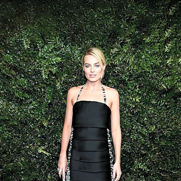 Margot Robbie Showcases 'With Jean' Skirt with Thigh-High Slit in Paris