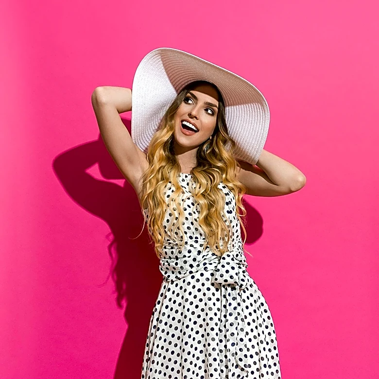 Fashion Trends Highlight Polka Dots, Silk Slips, and Gingham for Summer, with Trench Coats as Key Layering Pieces