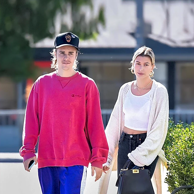 Hailey Bieber and Nina Dobrev Popularize Baby-Pink Activewear Shorts as a Chic Alternative to Black Leggings