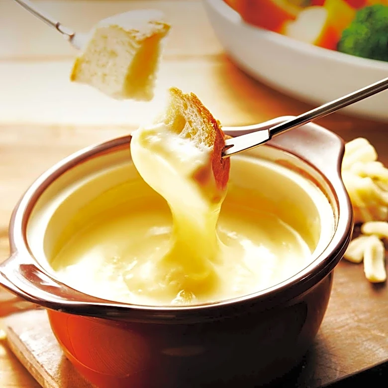 1960s American Dinner Tables Featured Fondue, Casseroles, and International Cuisine