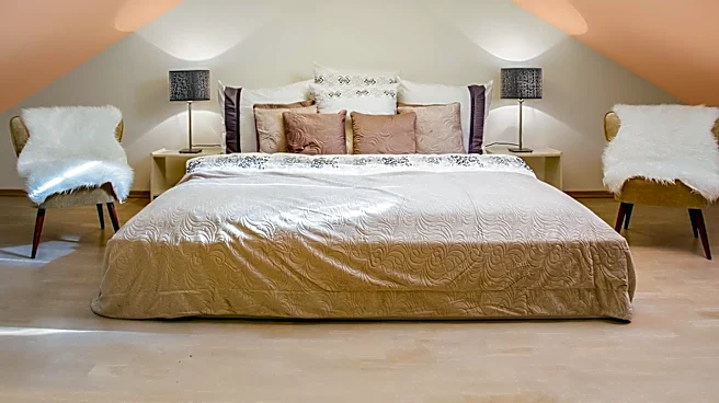 1908 Attic Renovation Preserves Original Architectural Features with Plaid Wallpaper