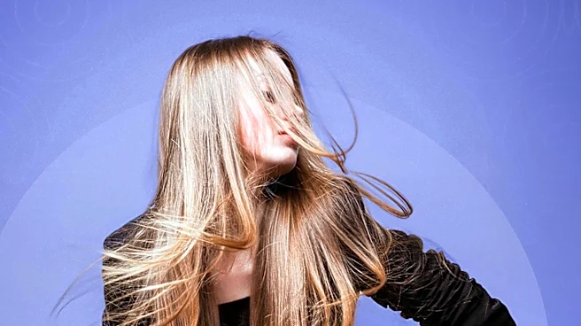 Knoxville Woman Sets Guinness World Record for Longest Mullet, Inspired by Aimee Mann