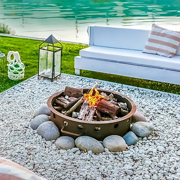 Outdoor Fire Pit Designs Incorporate Natural Stone, Tile, and Integrated Architecture for Enhanced Aesthetics and Functionality