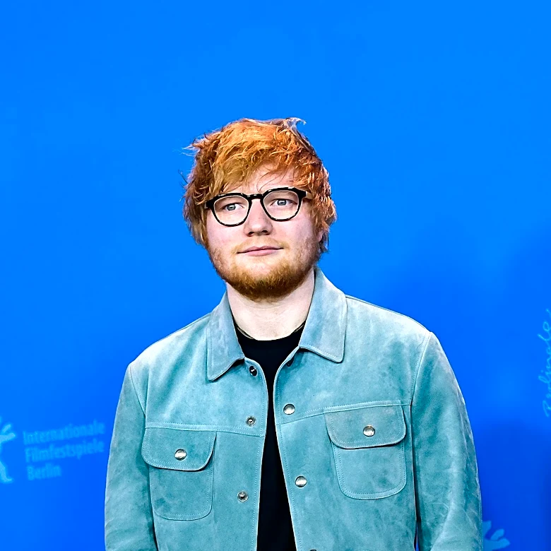 Ed Sheeran Clarifies Macklemore's Removal from U.S. Tour, Citing Venue Demands