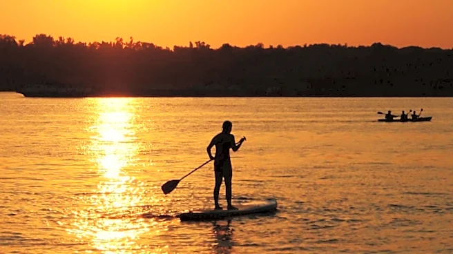 Kate Vallas Pioneers Paddleboard Yoga in Jacksonville Since 2009