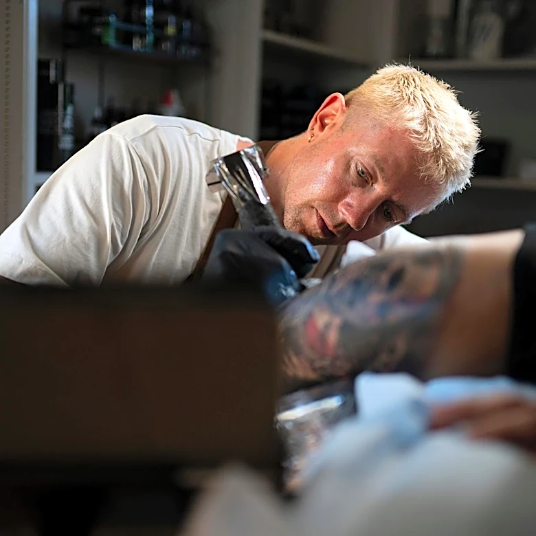 Former Traditionalist Catholic Priest Embraces Gay Identity and Tattoo Artistry in Pennsylvania