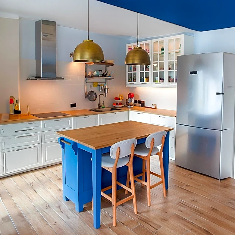 Kitchen Renovation Transforms "Dated and Drab" Space into Modern Design with Blue Paint