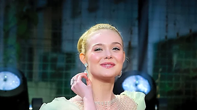 Elle Fanning Showcases Custom Valentino Ensemble for 'Hunger Games' Press Event