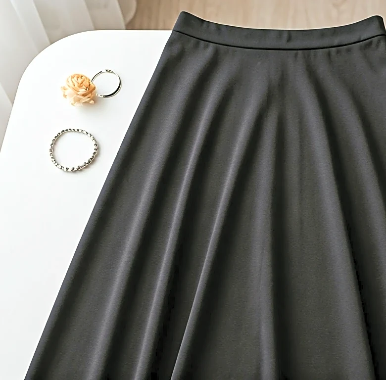 Why a Seasonless Black Midi Skirt