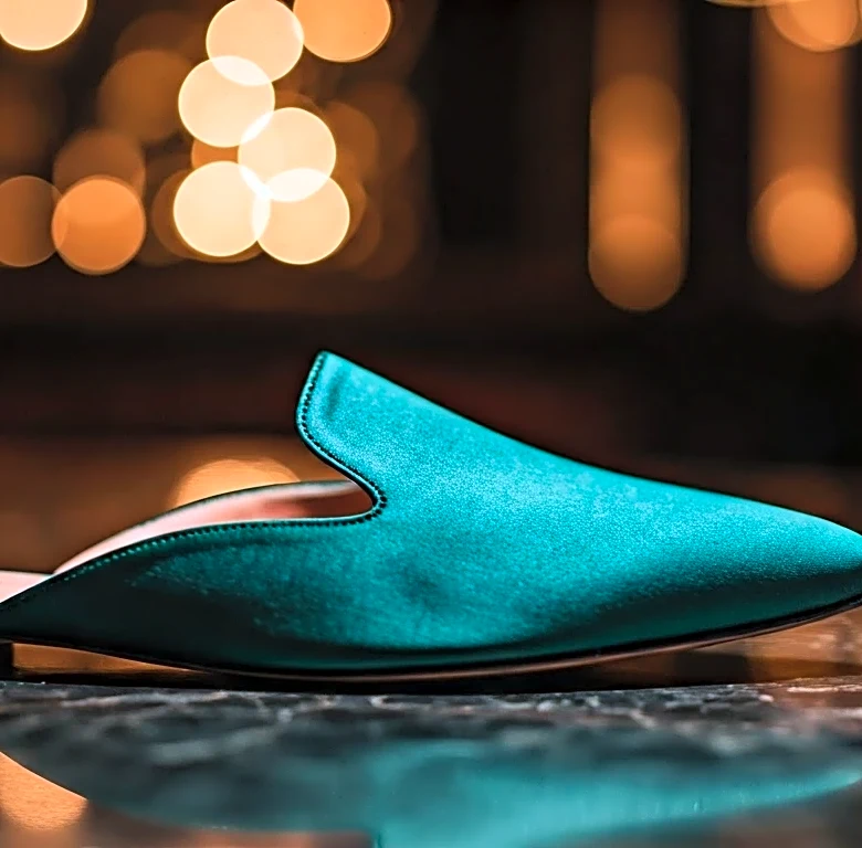 Why the Rule-Breaking Elegance of Wearing a Flat Mule After Dark