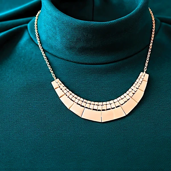 How Stylists Choose Choosing Jewelry Scale With a High Neckline