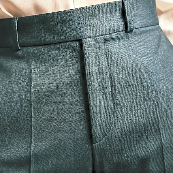 Why Designers Keep Pairing Delicate Tops With Severe Trousers