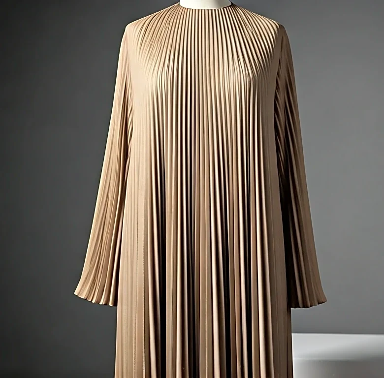 What the Rise of Micro-pleated Shirt Dresses Reveals About Class Codes, Sport, and Taste, with a Savile Row Approach to Ease