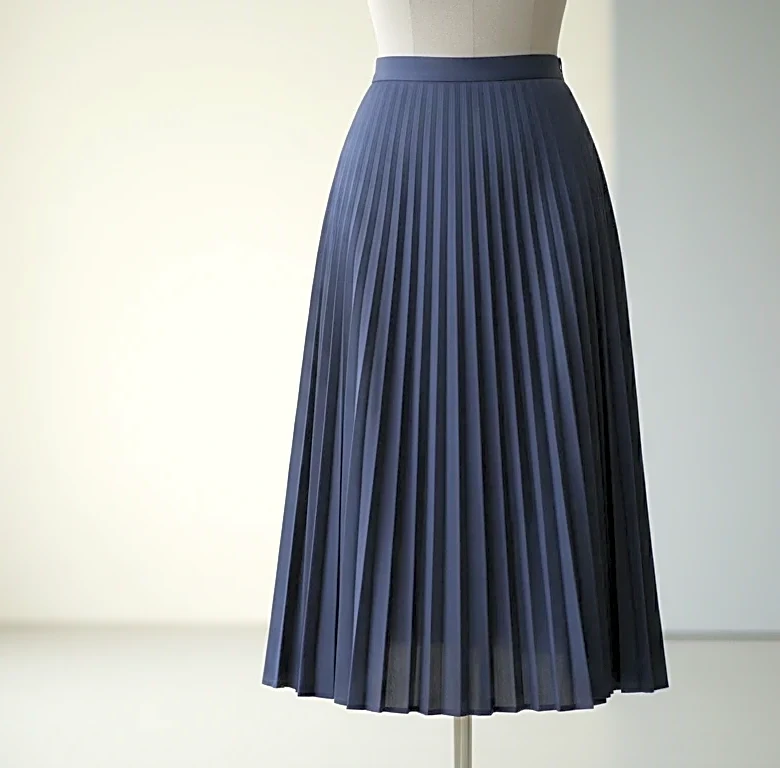 The Tailoring Fix That Makes Box-Pleat Midi Skirts Feel More Intentional