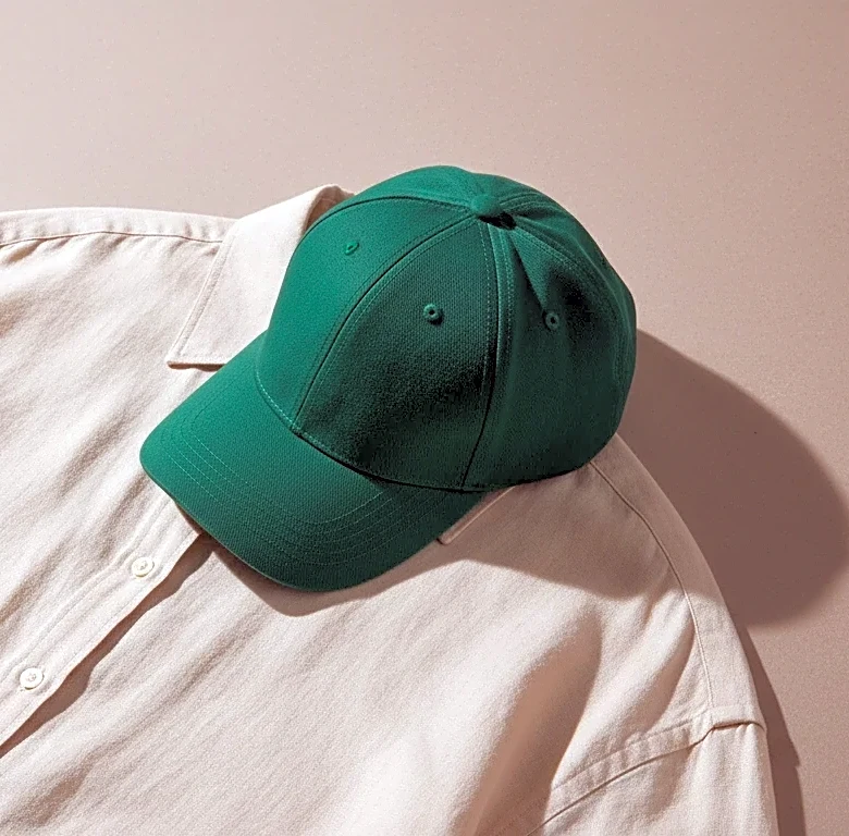 Skip the Team Colors and Wear a Neutral Outfit With One Bold Cap