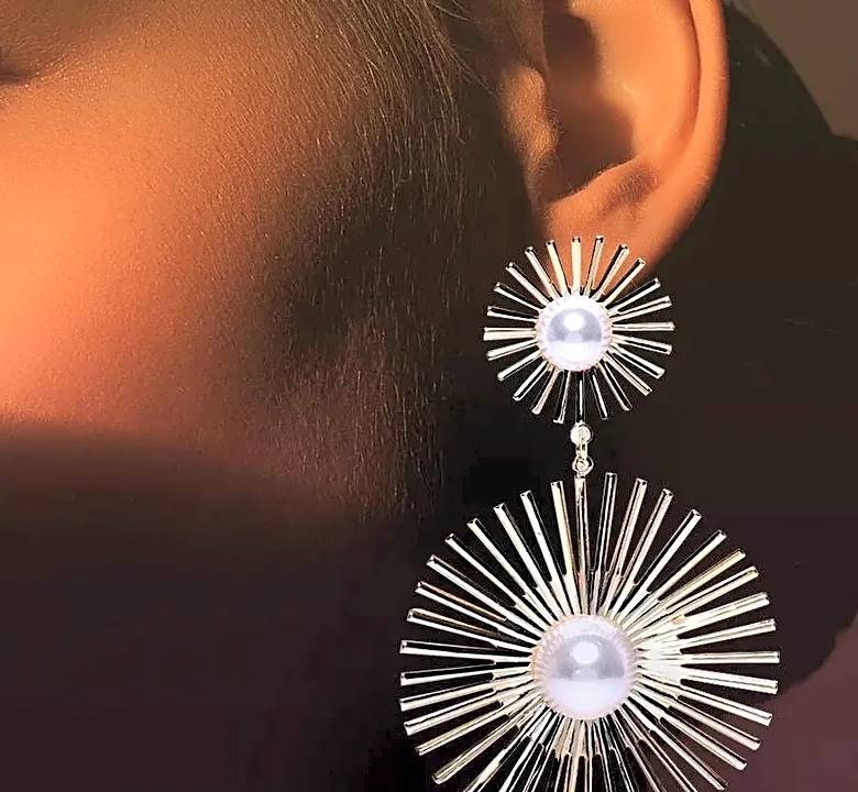 Why Sleek Hair and Statement Earrings Work So Well Together