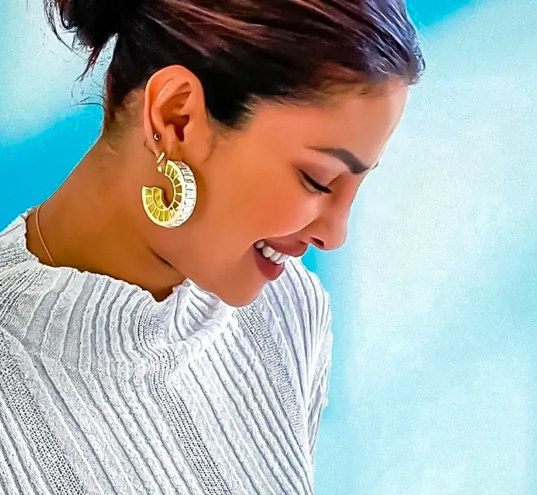 Why Oversized Earrings Work Best With Simpler Necklines