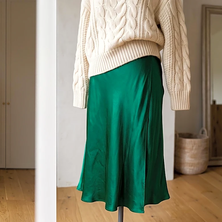 How to Wear a Sweater Over a Dress Without Losing the Waistline