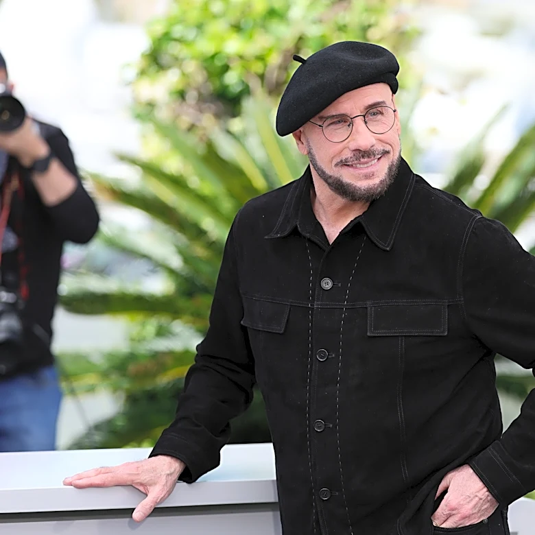 John Travolta's 'old-school director' ensemble at Cannes goes viral
