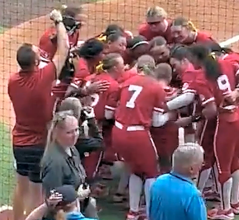 Sooners crowd carries boy through national anthem when he can't continue