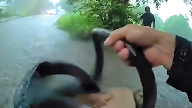 Watch: Texas officers rescue baby from car trapped in floodwaters