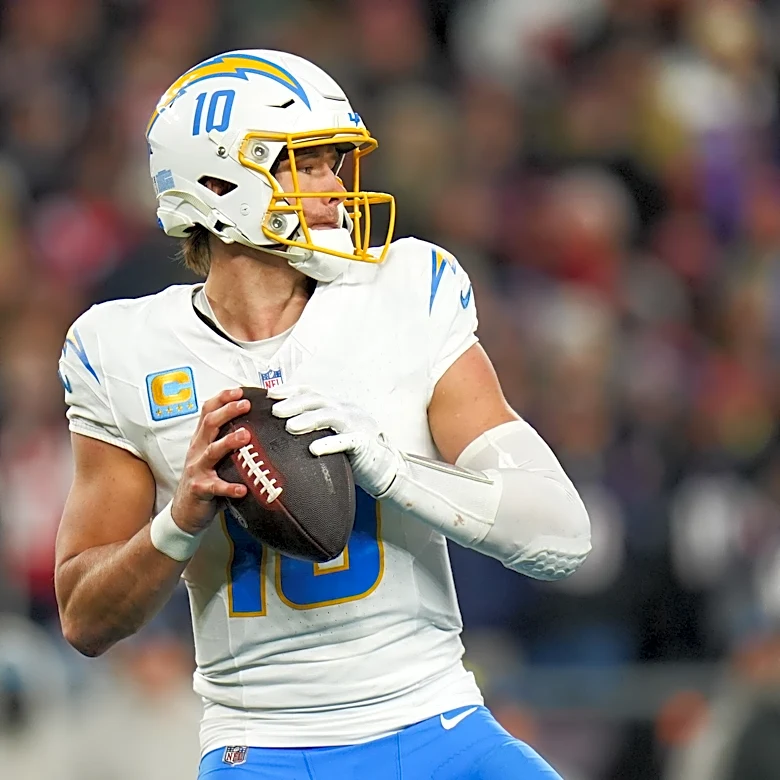 Jim Harbaugh 'happy' Justin Herbert skipped OTA session to support Madison Beer