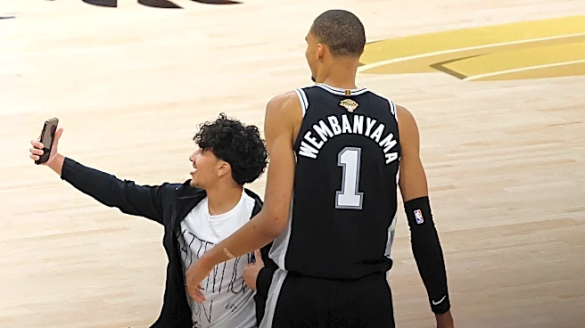 NBA Finals fan who ran onto court for Wemby selfie arrested, banned
