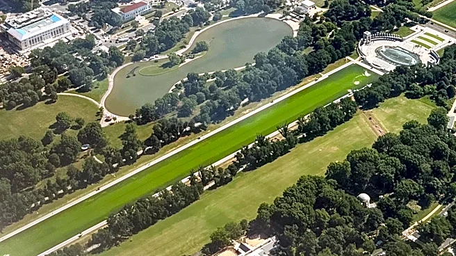 Aerial photo shows green Reflecting Pool, damaged South Lawn, more
