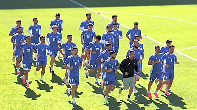 Iran coach again criticizes treatment of team, calls them `oppressed'