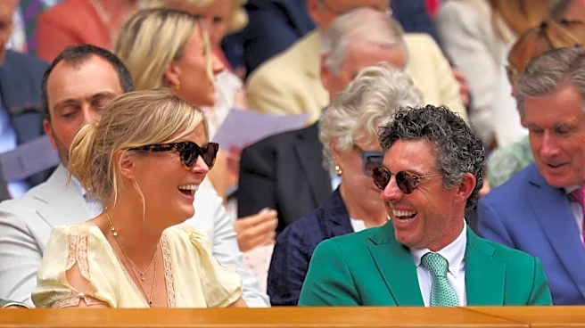 Rory McIlroy watches Jannik Sinner at Wimbledon in Masters green jacket
