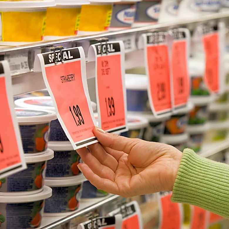 Americans are draining savings to pay for groceries, survey shows