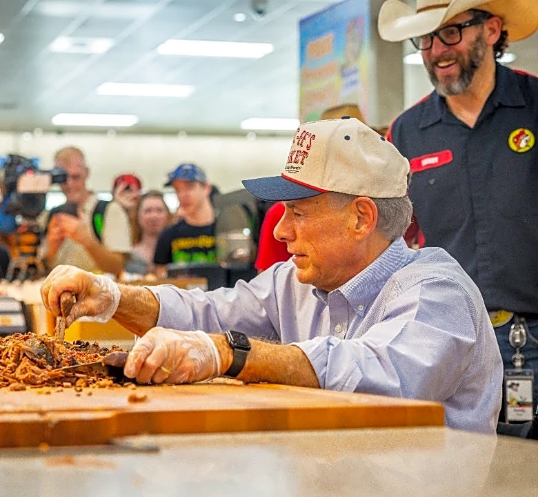 Watch Gov. Greg Abbott serve brisket at Buc-ee's newest Texas store