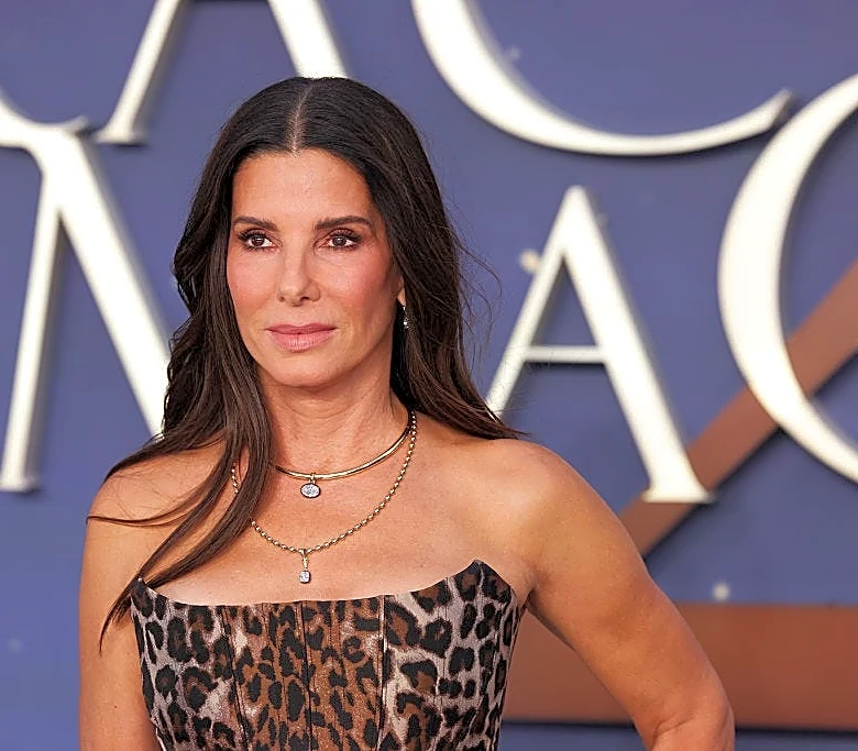 Sandra Bullock says her favorite Dolly Parton memory involves a tour bus