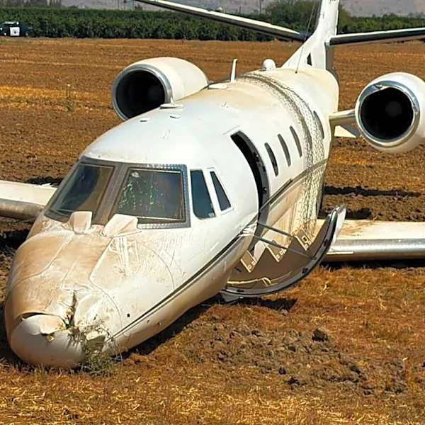 Plane slides off runway during landing attempt in Porterville