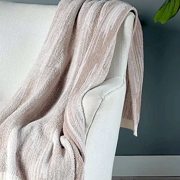 This cult-favorite Barefoot Dreams blanket is less than $45 right now