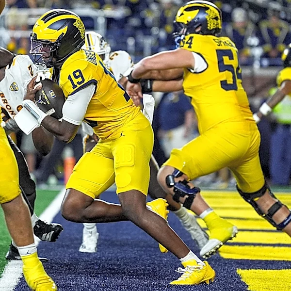 Michigan fans storm field after miracle Hail Mary TD vs Western Michigan