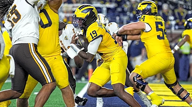 Michigan fans storm field after miracle Hail Mary TD vs Western Michigan