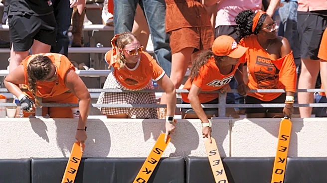 Oklahoma State storms field after stunning Oregon for Eric Morris' first win