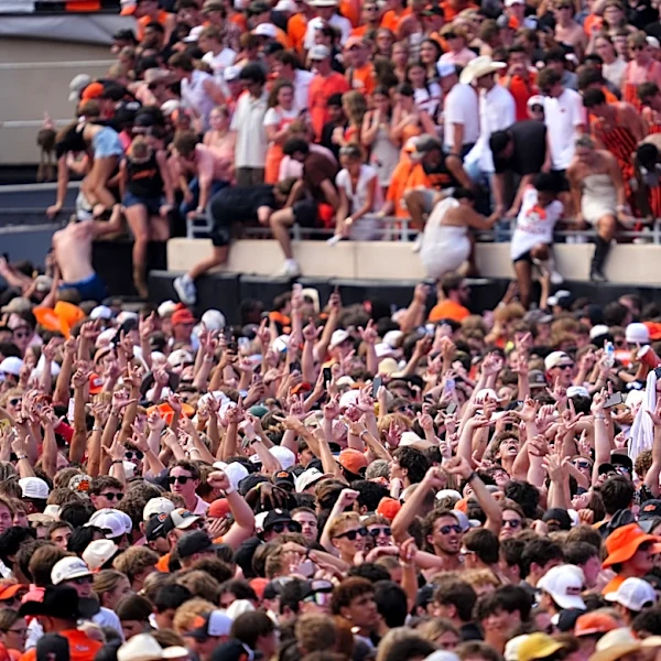The full path Oklahoma State's goalposts took to nearby pond after Oregon upset