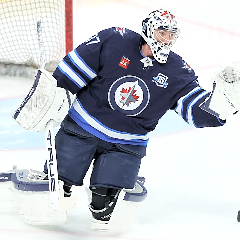 Jets' Connor Hellebuyck suspended for not reporting to training camp amid trade request