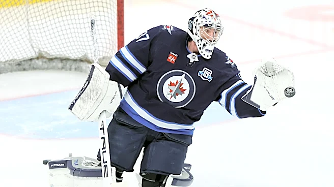 Jets' Connor Hellebuyck suspended for not reporting to training camp amid trade request