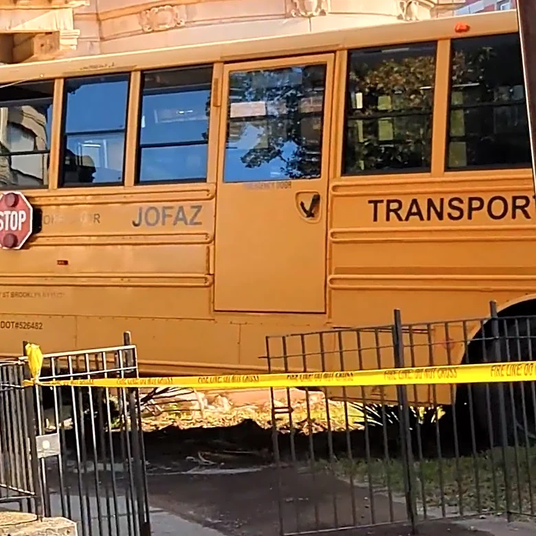 Video: School bus slams into New York City residential building