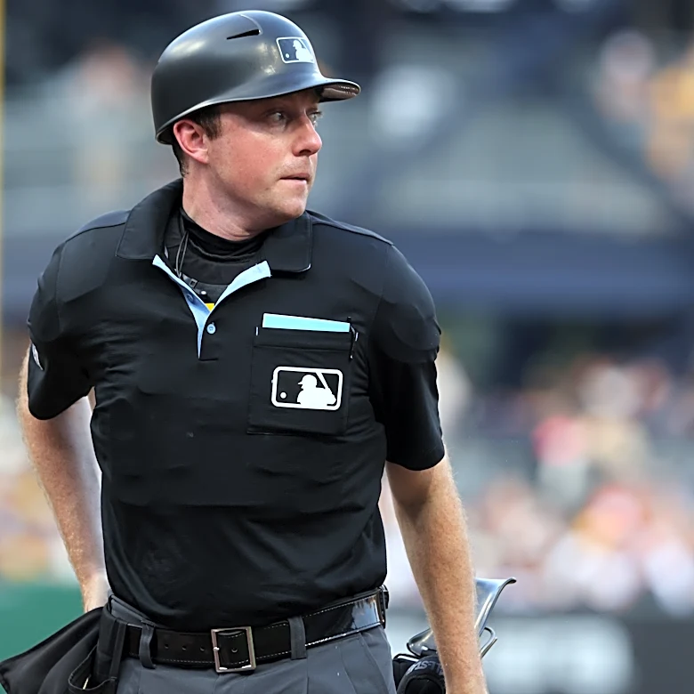 Identical twin umpires make MLB history by suiting up together