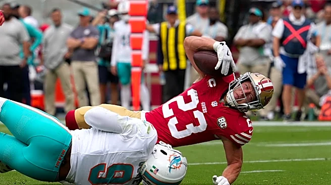 Christian McCaffrey practicing Friday