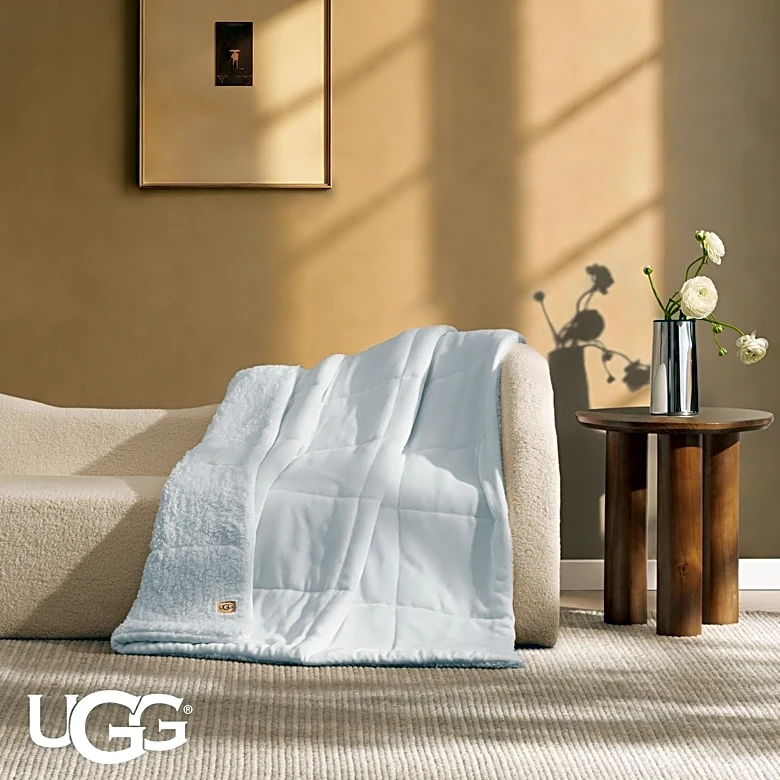 Cozy season is here — snuggle up with an UGG blanket for less than $50