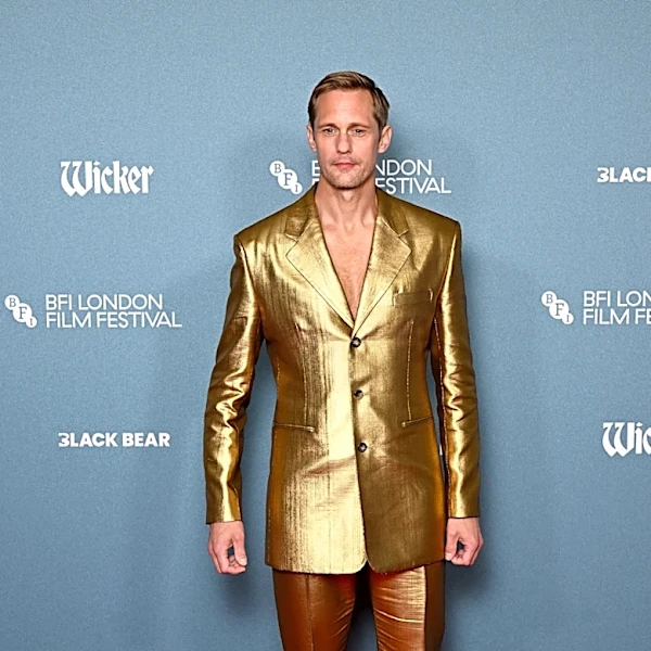 Alexander Skarsgård shines in gold suit and controversial clear shoes