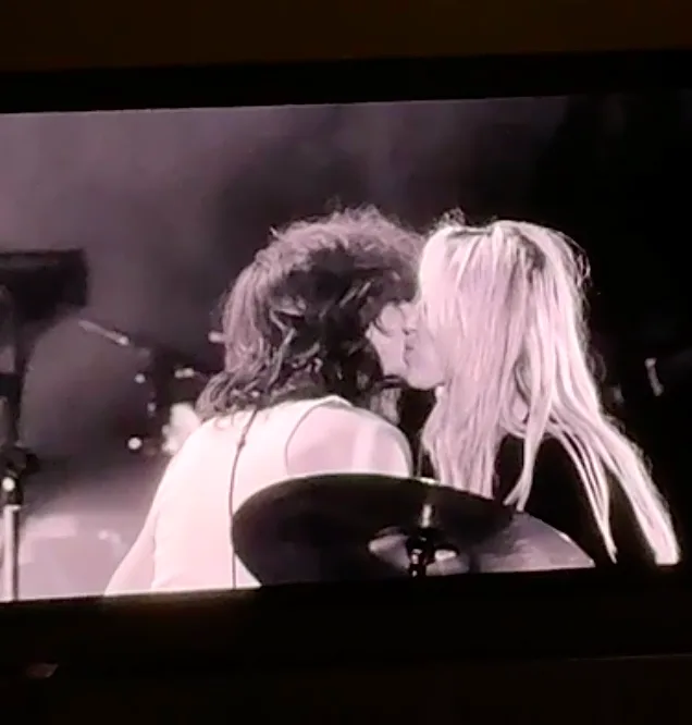 Miley Cyrus returns to stage with Maxx Morando kiss, tearful Dolly Parton tribute