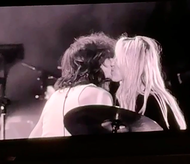Miley Cyrus returns to stage with Maxx Morando kiss, tearful Dolly Parton tribute