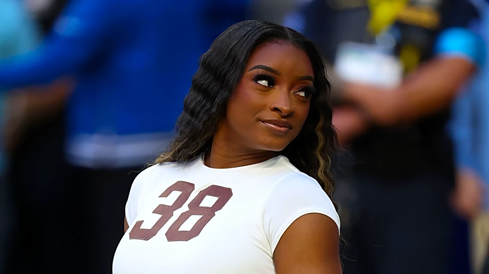 Simone Biles rocks all-white with 'football material' at Colts game