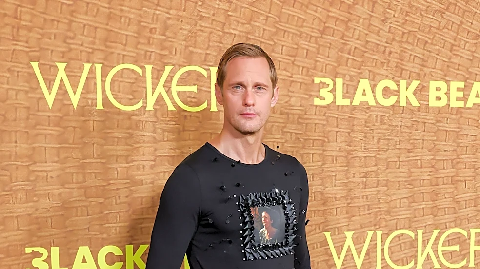 Alexander Skarsgård rocks shirt with Olivia Colman's face, plaid skirt